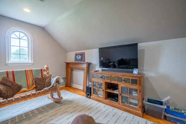 a view of a livingroom with furniture and wooden floor