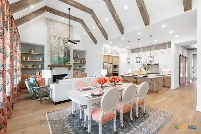 a view of an outdoor dining space with a table and chairs