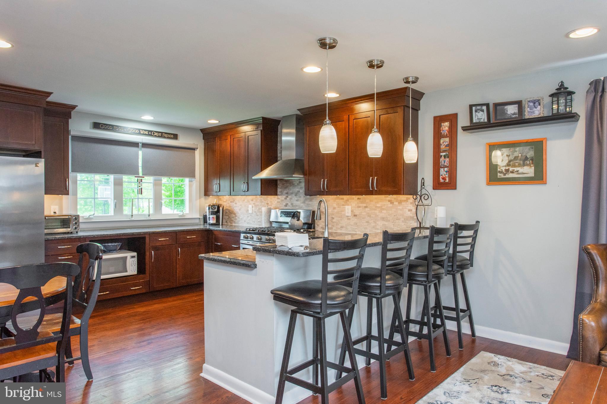 508 Exton Road Hatboro, PA 19040 - Photo 17 of 36 a kitchen with a table chairs stove and cabinets