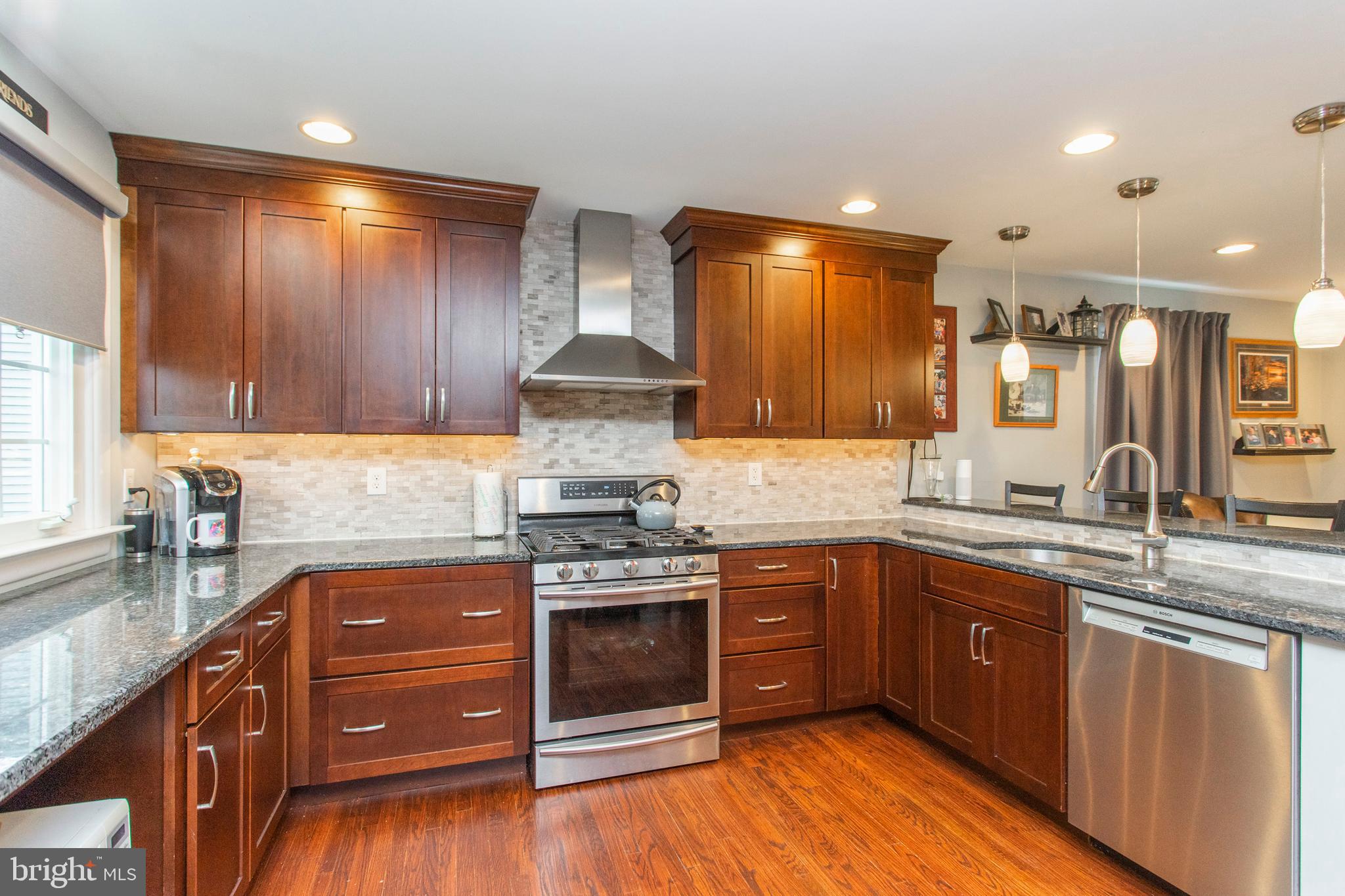 508 Exton Road Hatboro, PA 19040 - Photo 21 of 36 a kitchen with stainless steel appliances granite countertop wooden cabinets and a sink