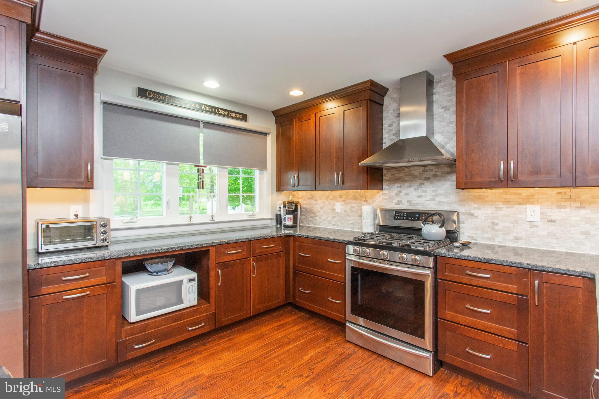 508 Exton Road Hatboro, PA 19040 - Photo 22 of 36 a kitchen with stainless steel appliances granite countertop a stove a sink and a refrigerator