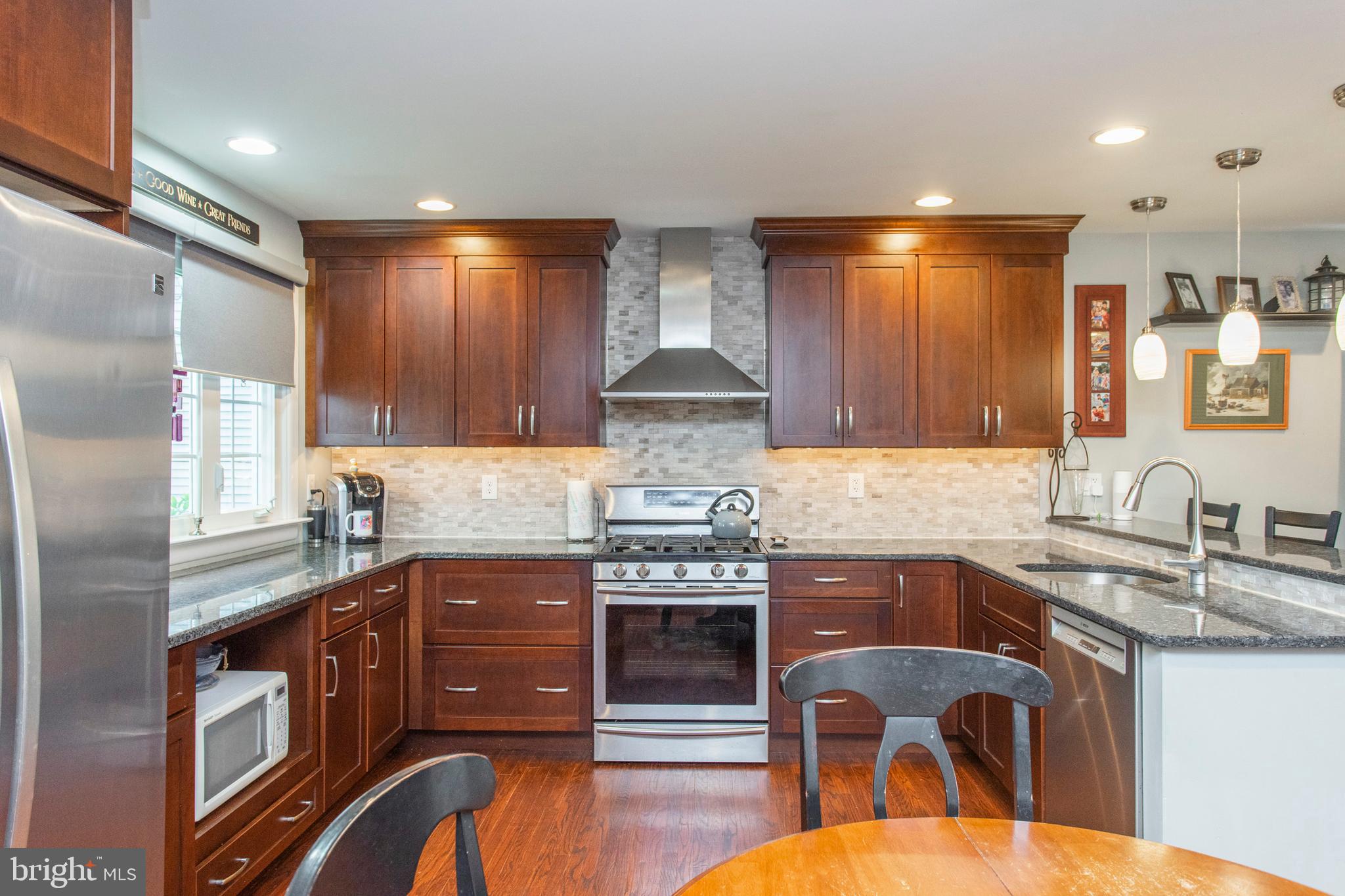 508 Exton Road Hatboro, PA 19040 - Photo 25 of 36 a kitchen with stainless steel appliances granite countertop a stove and a sink