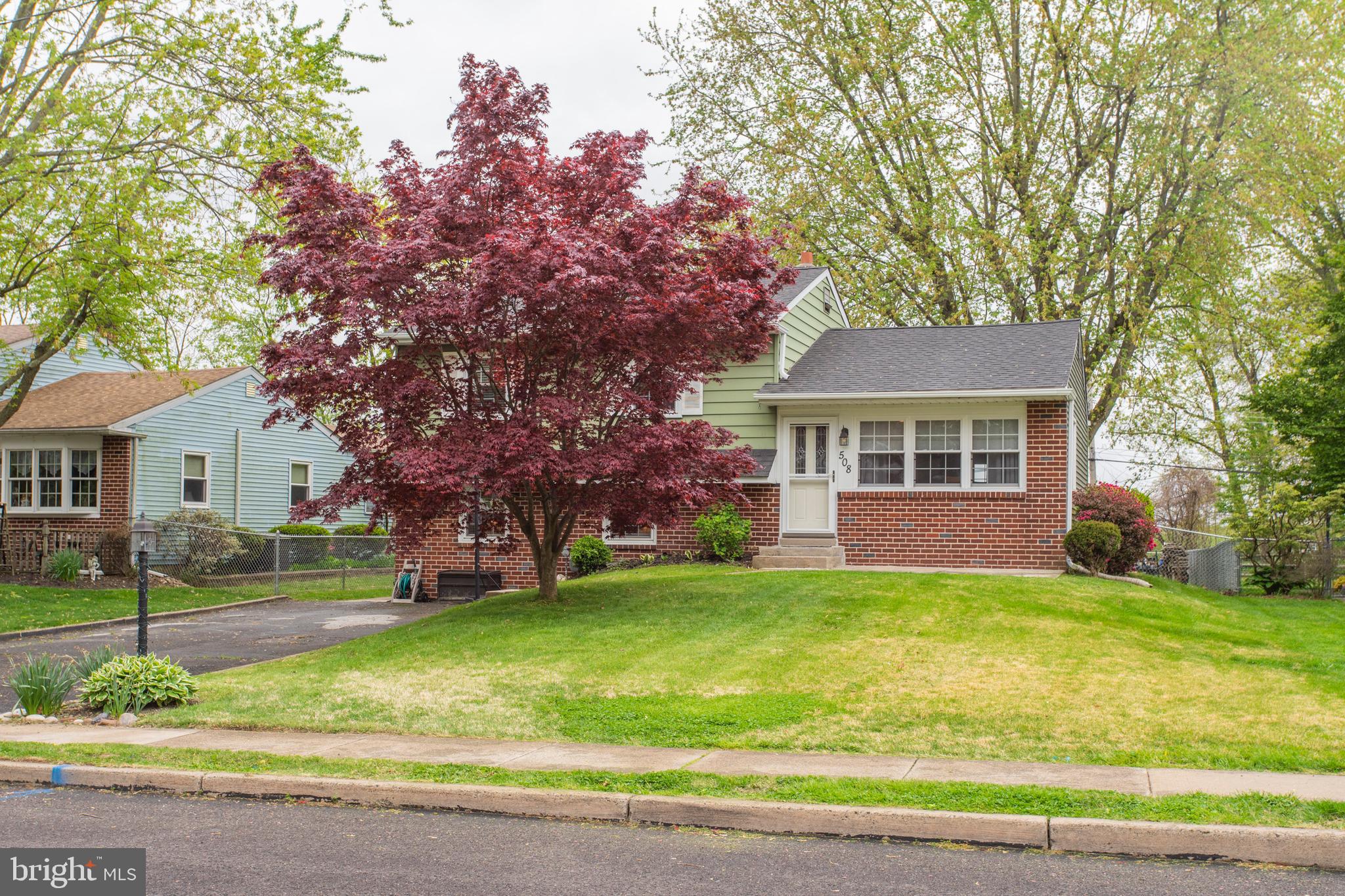 508 Exton Road Hatboro, PA 19040 - Photo 4 of 36 a front view of a house with a yard and garage