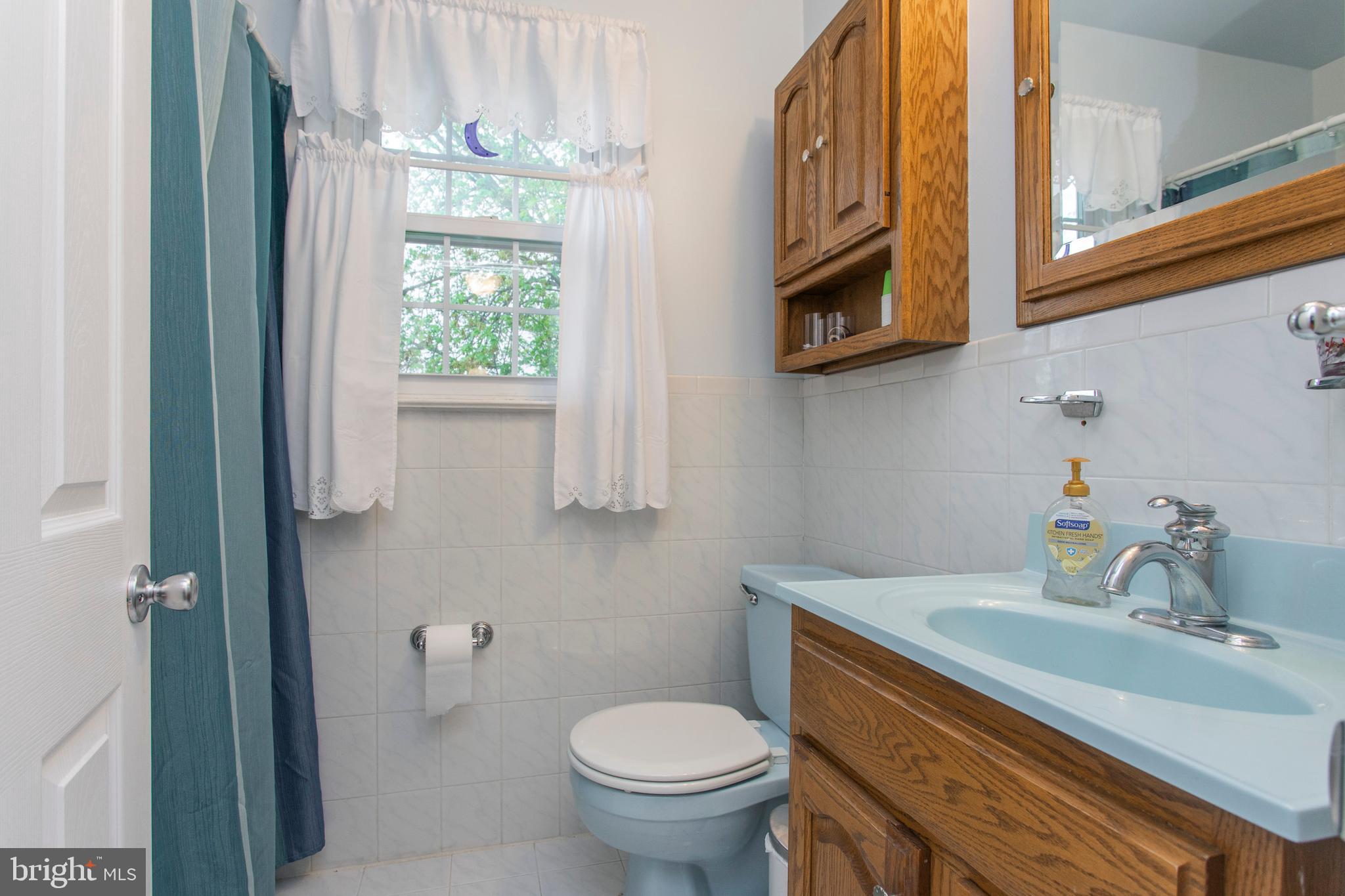 508 Exton Road Hatboro, PA 19040 - Photo 36 of 36 a bathroom with a granite countertop toilet sink and mirror