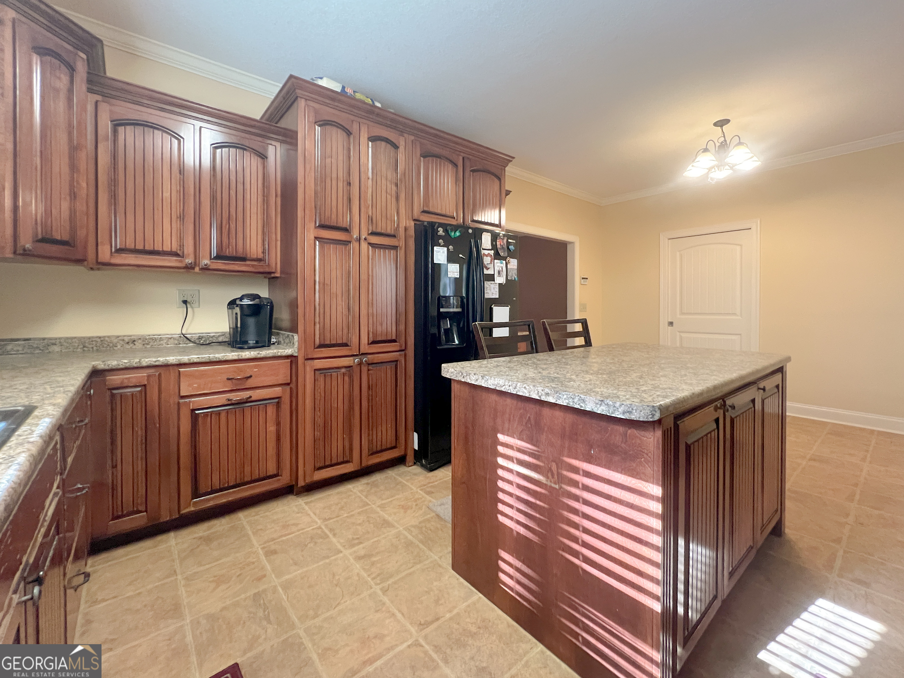 1610 Clifton Road Statesboro, GA 30458 - Photo 15 of 37 a kitchen with granite countertop a stove cabinets and refrigerator