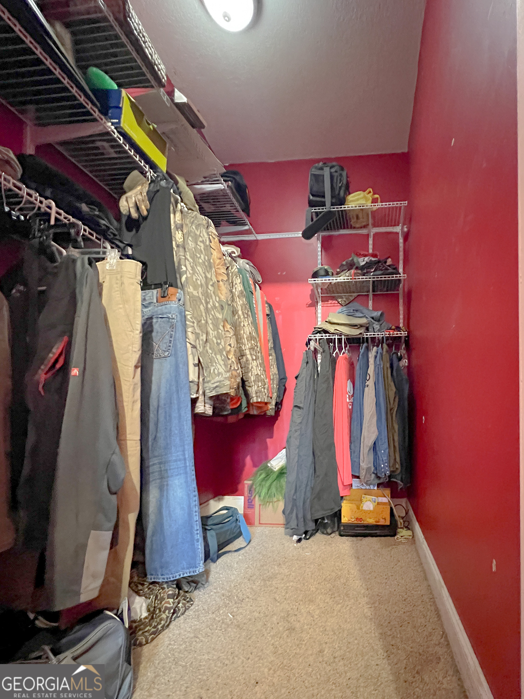1610 Clifton Road Statesboro, GA 30458 - Photo 25 of 37 a view of walk in closet with clothes
