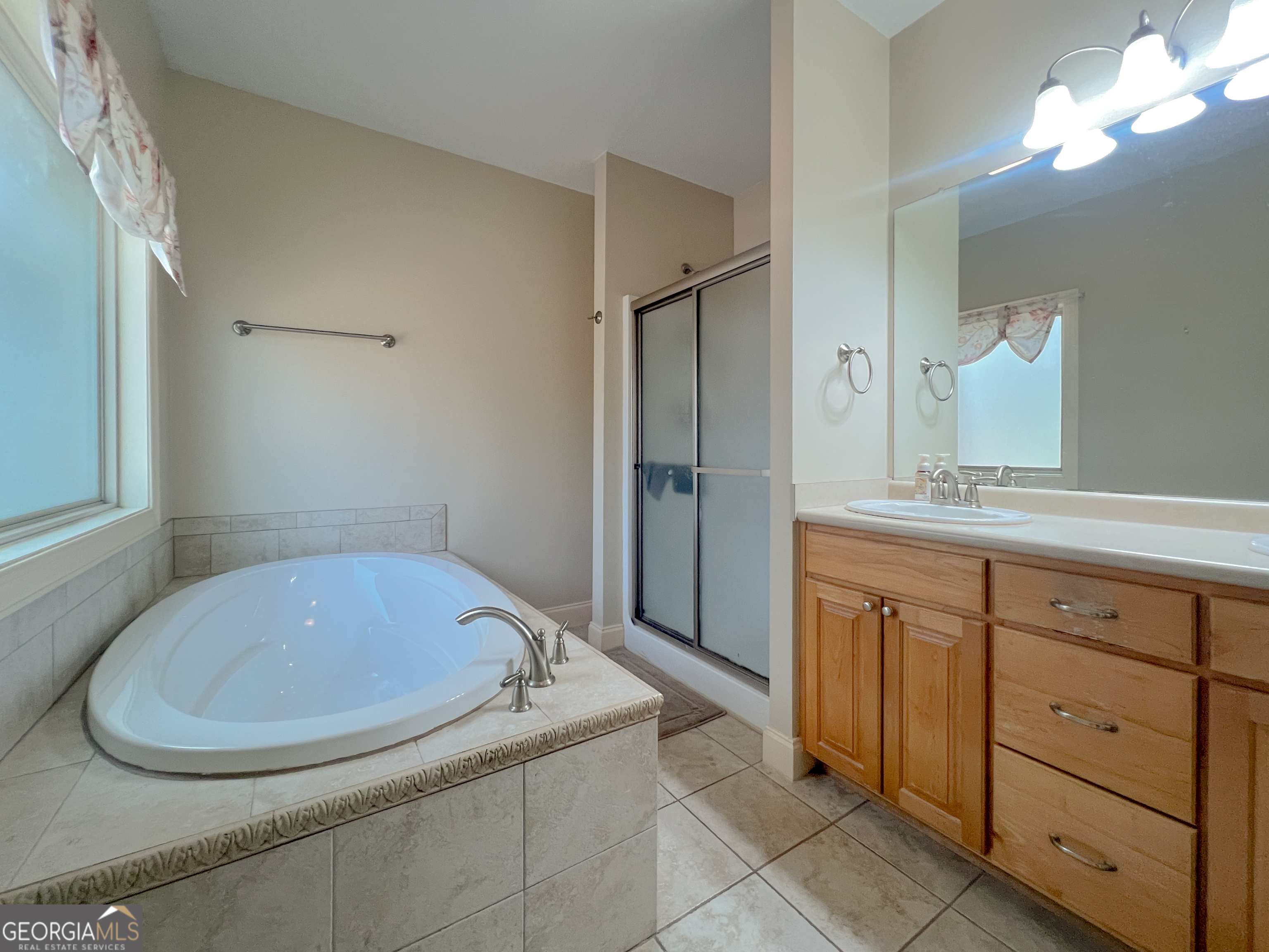 1610 Clifton Road Statesboro, GA 30458 - Photo 32 of 37 a bathroom with a sink and a mirror