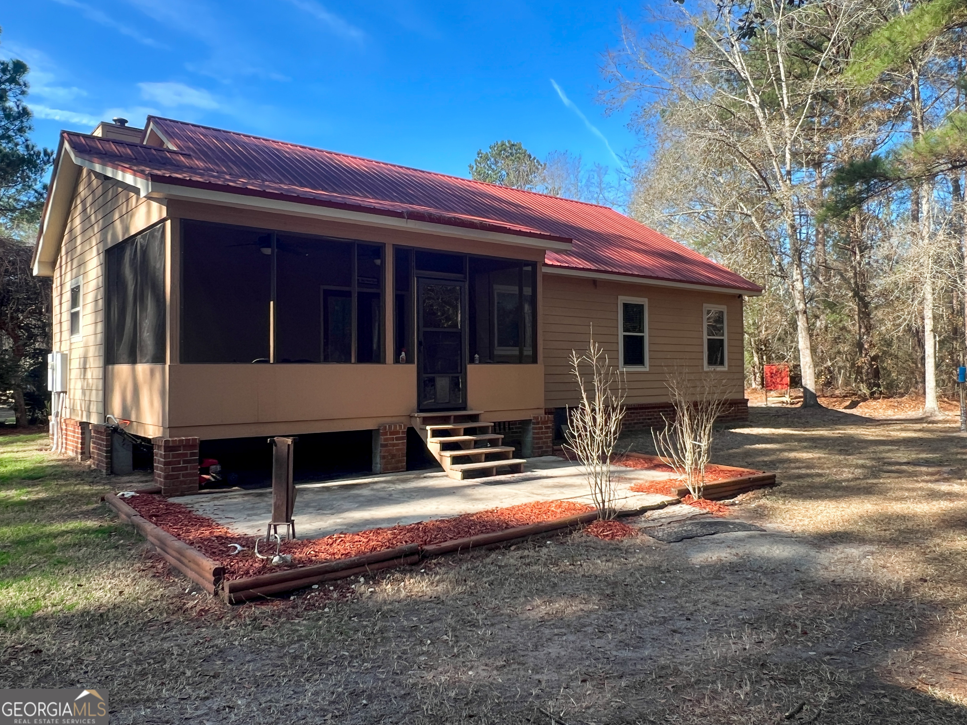 1610 Clifton Road Statesboro, GA 30458 - Photo 4 of 37 a view of a house with backyard and sitting area