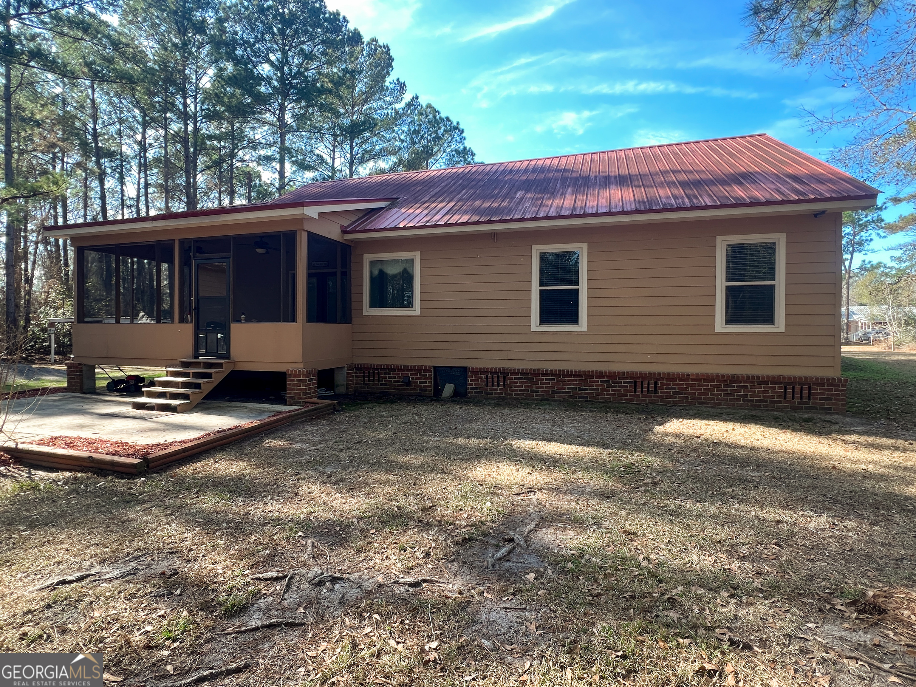 1610 Clifton Road Statesboro, GA 30458 - Photo 6 of 37 a view of a house with a yard