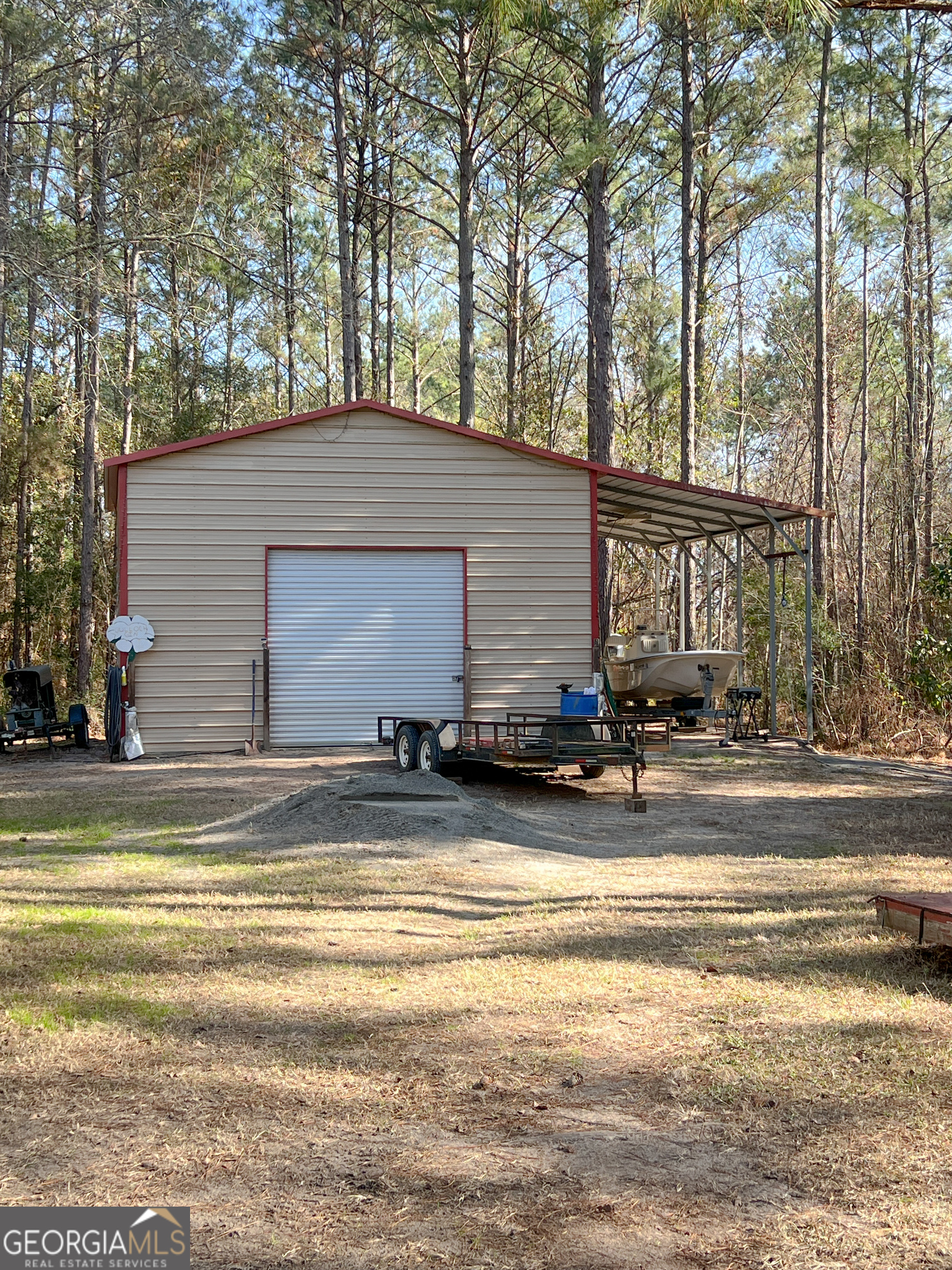 1610 Clifton Road Statesboro, GA 30458 - Photo 7 of 37 a view of a house with a patio and a big yard