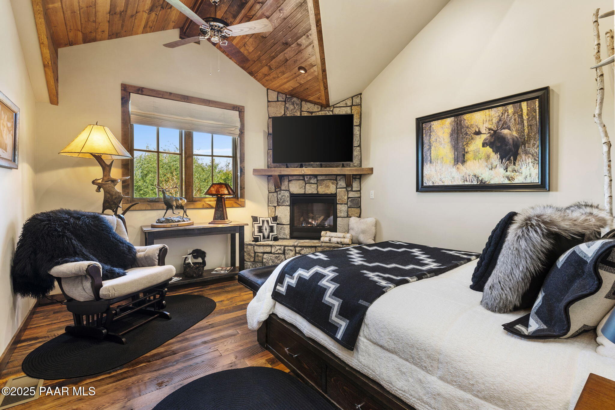 7520 North Williamson Valley Road Prescott, AZ 86305 - Photo 25 of 57 a bedroom with a bed and flat screen tv