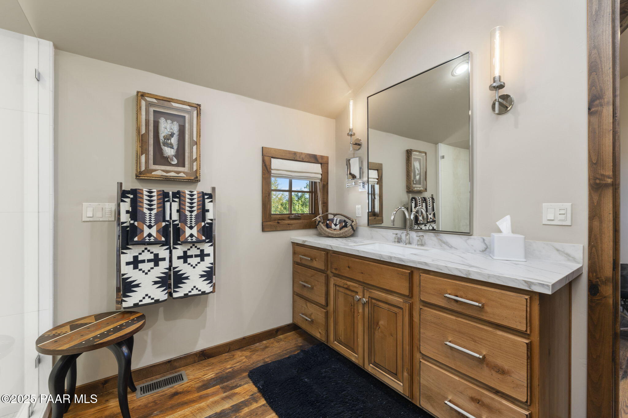 7520 North Williamson Valley Road Prescott, AZ 86305 - Photo 27 of 57 a bathroom with a granite countertop sink a mirror and a shower