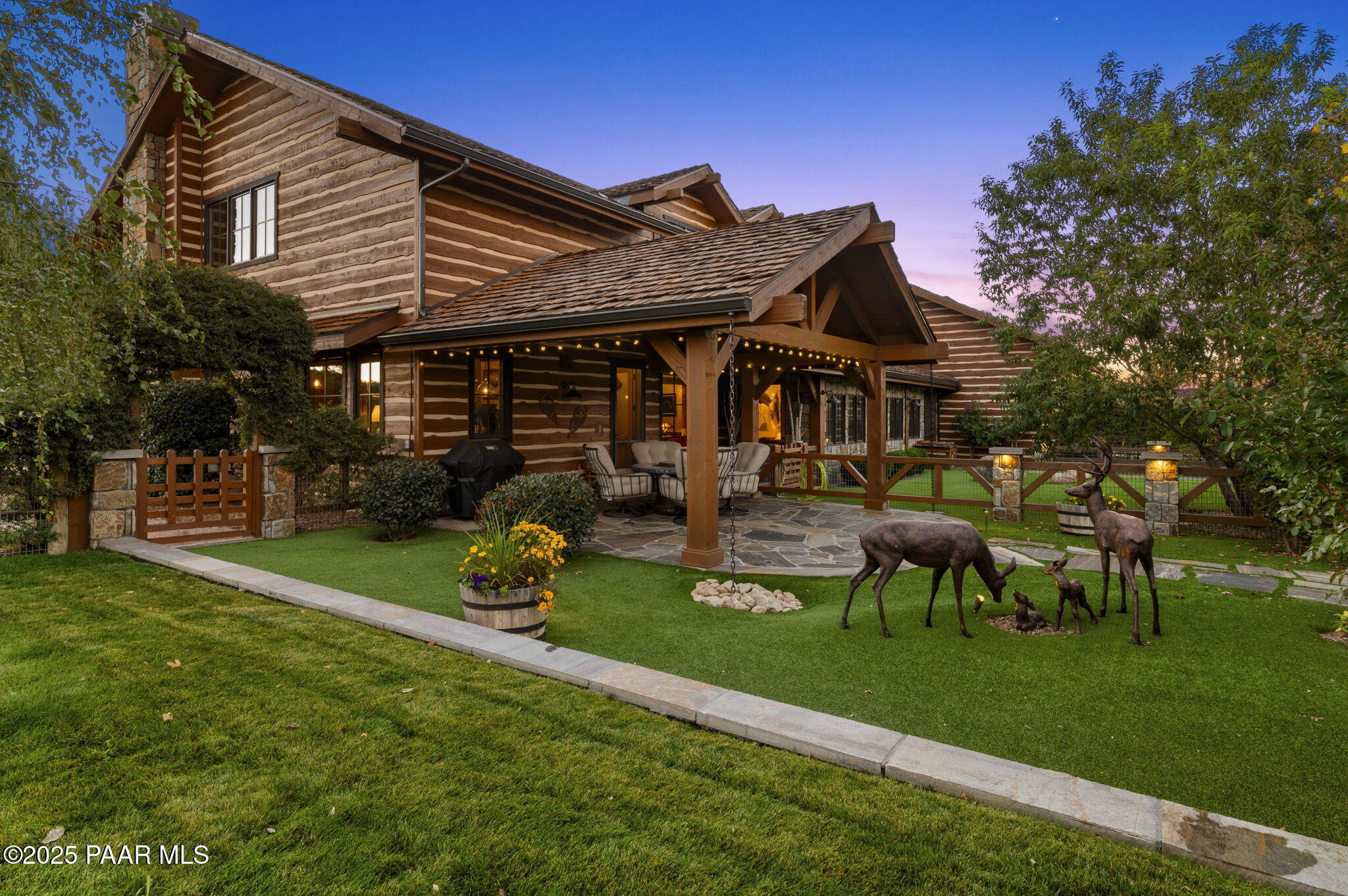 7520 North Williamson Valley Road Prescott, AZ 86305 - Photo 30 of 57 a front view of a house with garden and a sitting area
