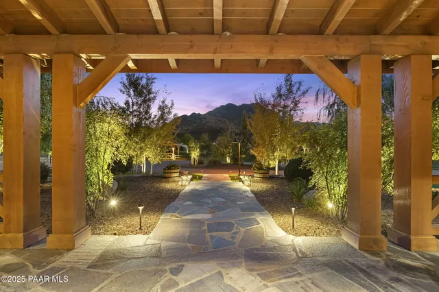 a view of a back yard of the house and a yard