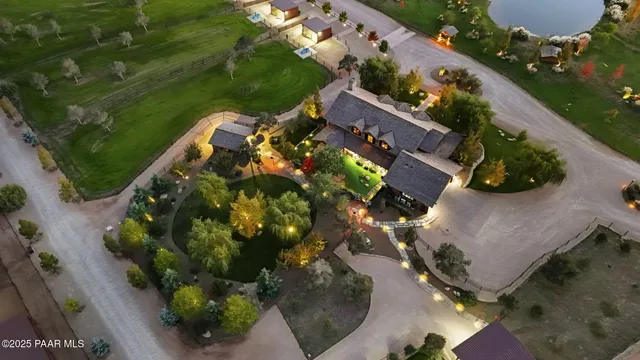 an aerial view of house with yard