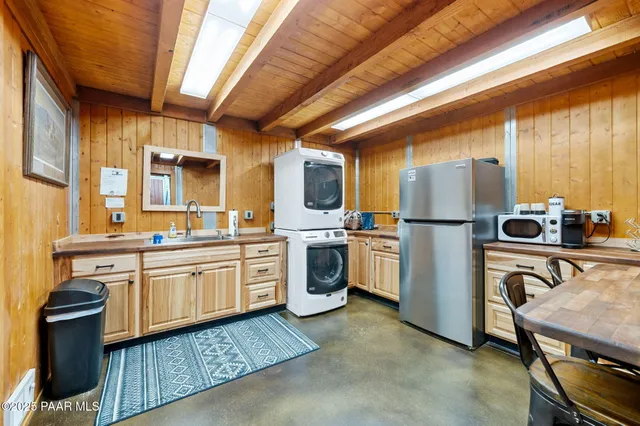 an aerial view of residential house with outdoor space and parking