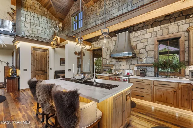 a front view of a house with outdoor seating