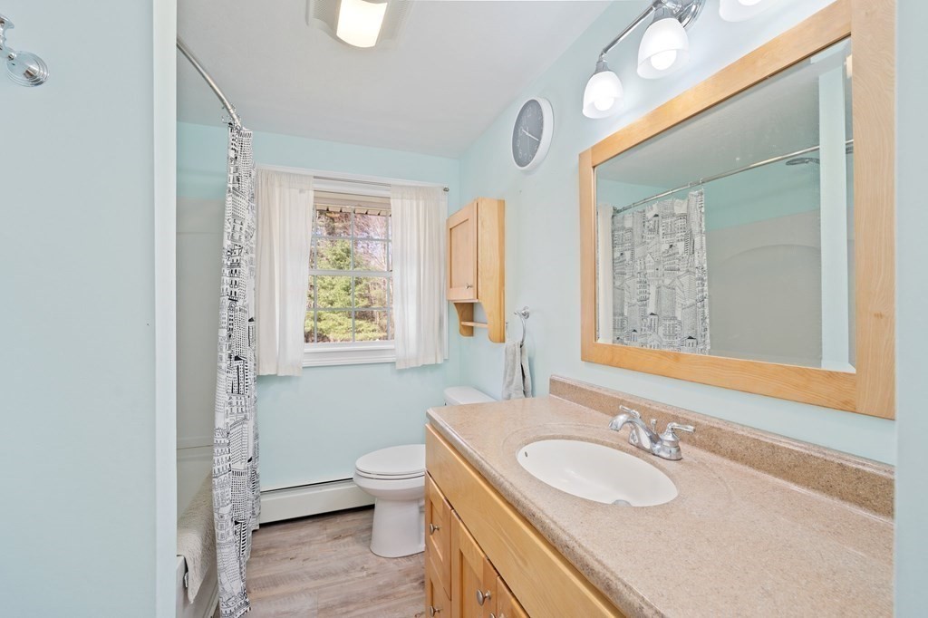 107 Brookfield Road Sturbridge, MA 01518 - Photo 15 of 36 a bathroom with a granite countertop sink toilet and a mirror