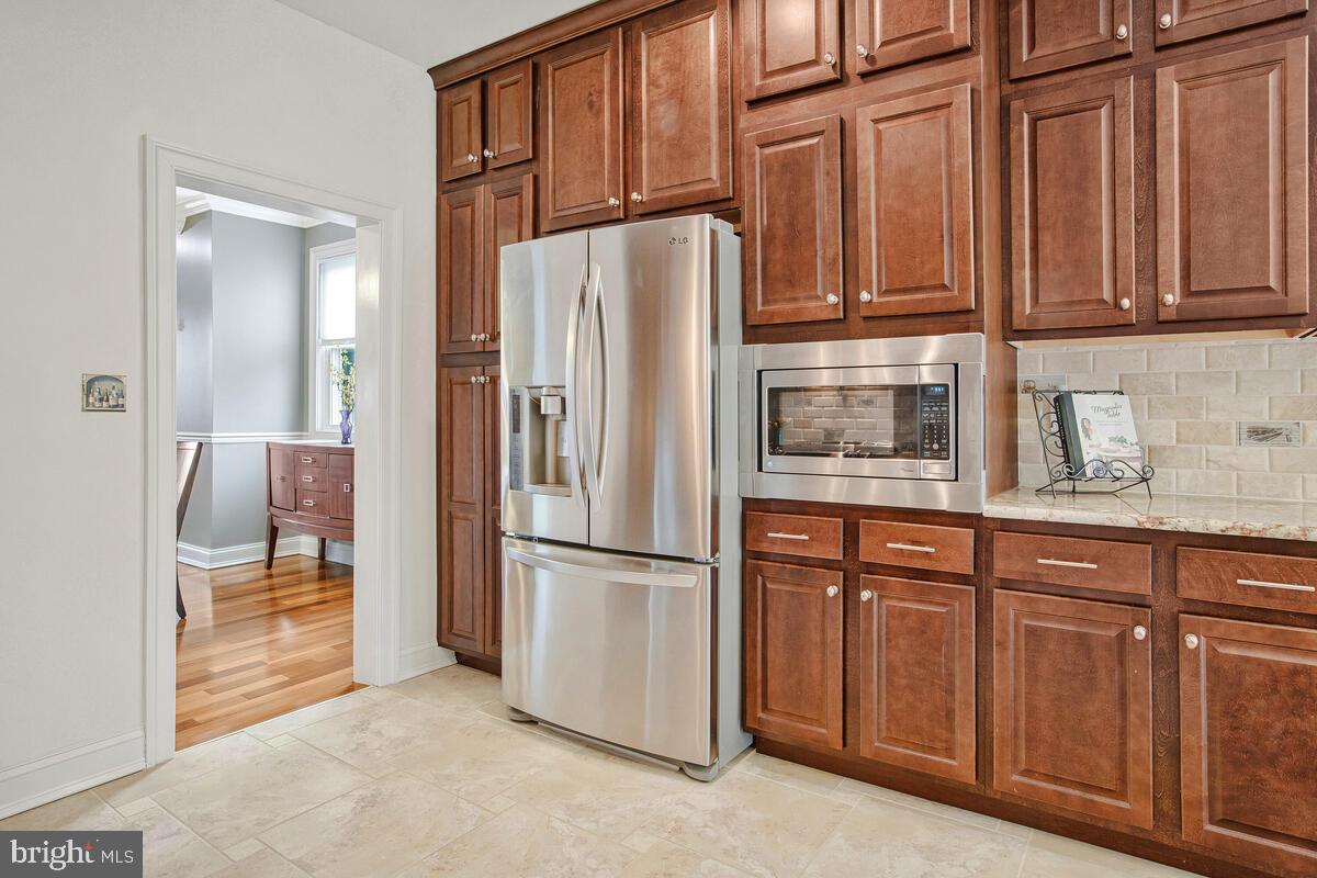 201 Charles Road Linthicum Heights, MD 21090 - Photo 15 of 50 a kitchen with stainless steel appliances granite countertop a refrigerator and a sink