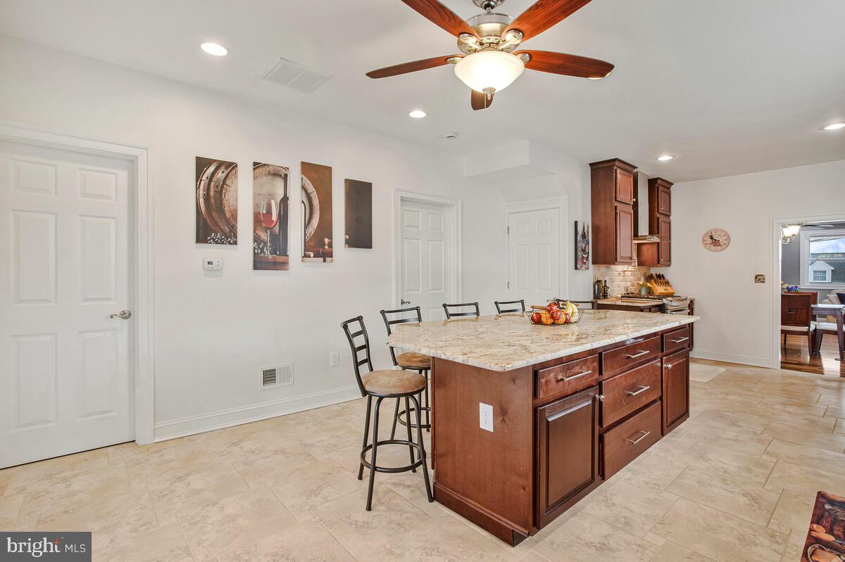 201 Charles Road Linthicum Heights, MD 21090 - Photo 16 of 50 a view of a kitchen with stainless steel appliances granite countertop a sink and a refrigerator