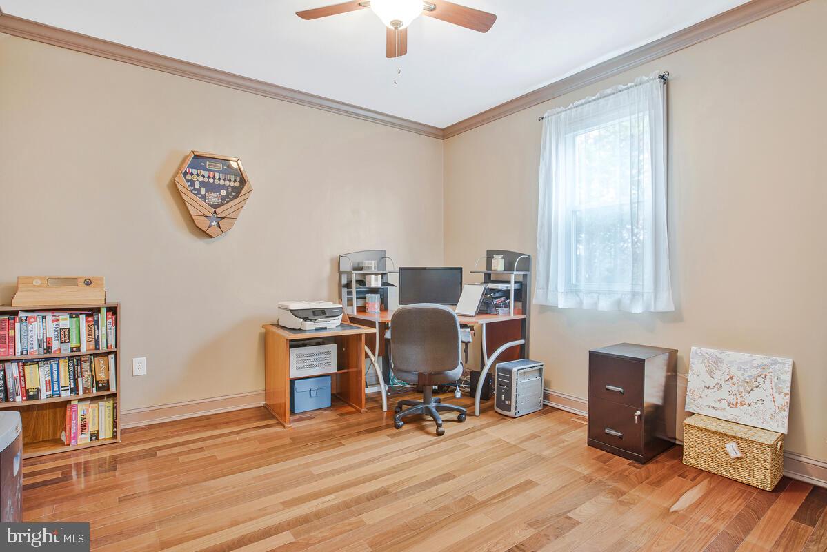 201 Charles Road Linthicum Heights, MD 21090 - Photo 21 of 50 a view of a workspace with furniture and a window