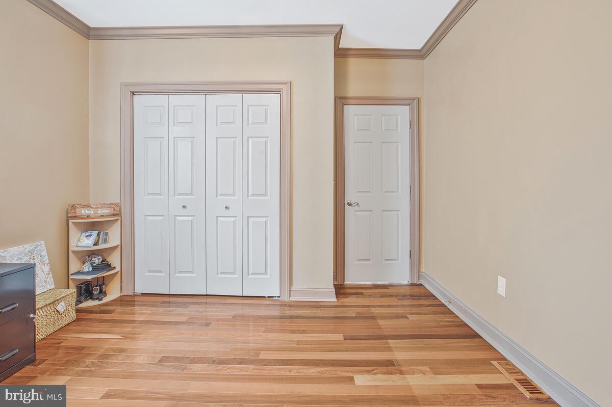 201 Charles Road Linthicum Heights, MD 21090 - Photo 22 of 50 a view of an empty room with room and wooden floor