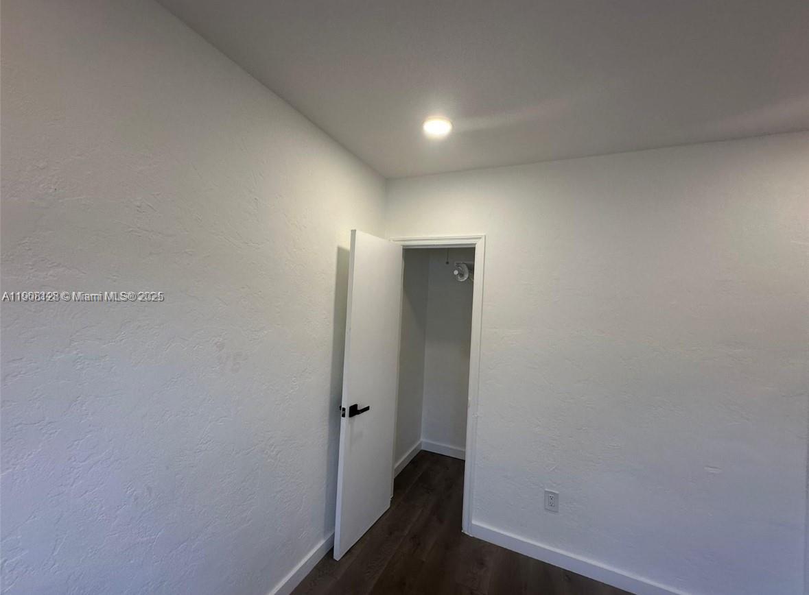 17175 Northeast 19th Avenue, Unit 6 North Miami Beach, FL 33162 - Photo 9 of 12 a view of hallway with closet