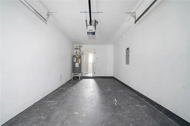 a view of a room with wooden floor and windows