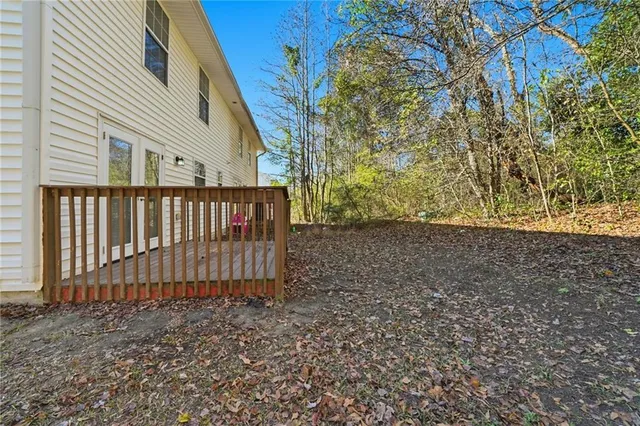 a view of a backyard with pathway