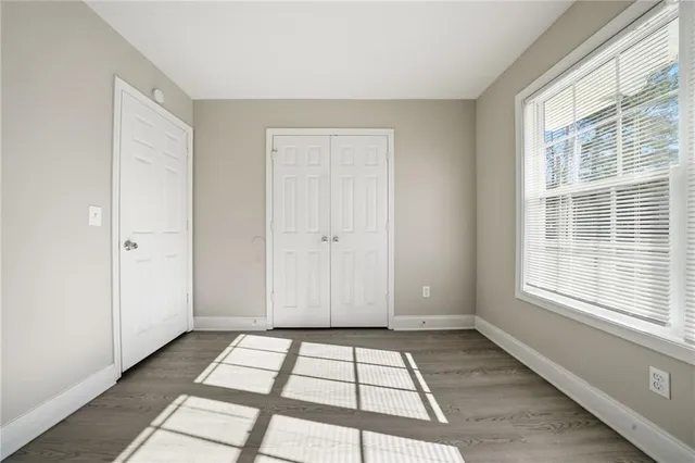 a view of empty room with windows