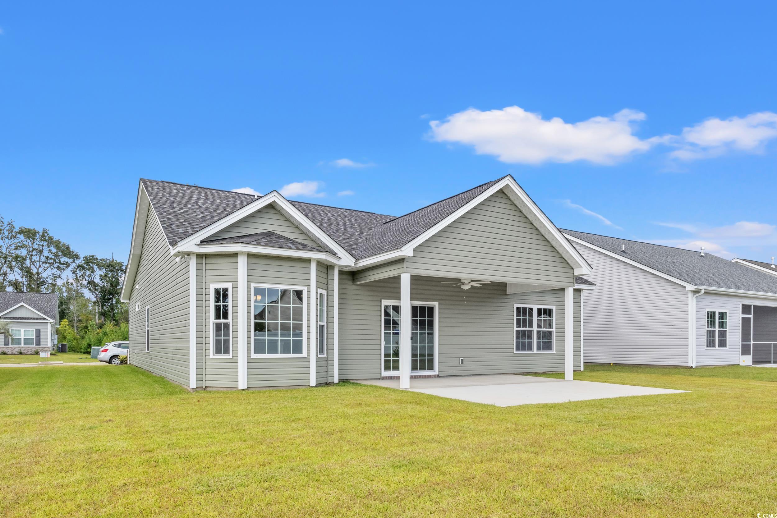 300 Lakota Loop Longs, SC 29568 - Photo 18 of 18 Rear view of house featuring a yard, ceiling fan,