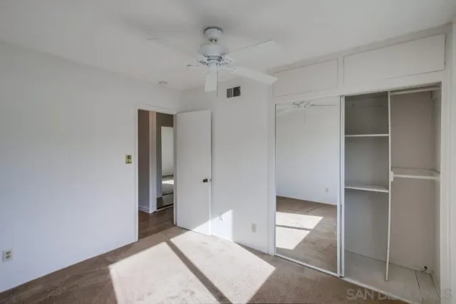 a spacious bathroom with a shower and a toilet