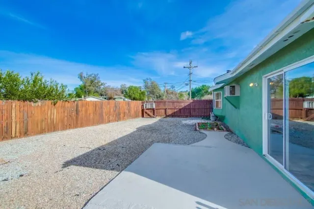 a house view with a backyard space