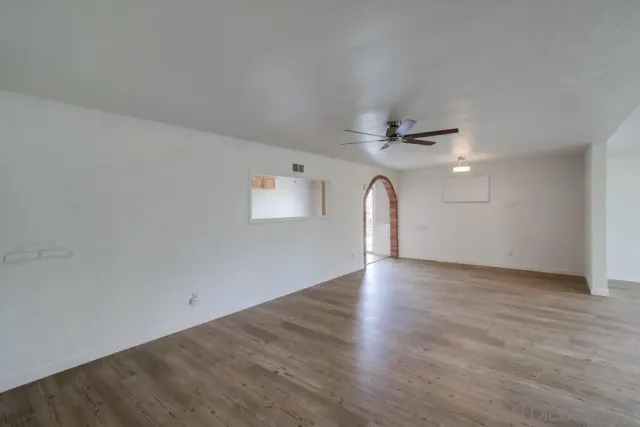 a view of a livingroom with wooden floor