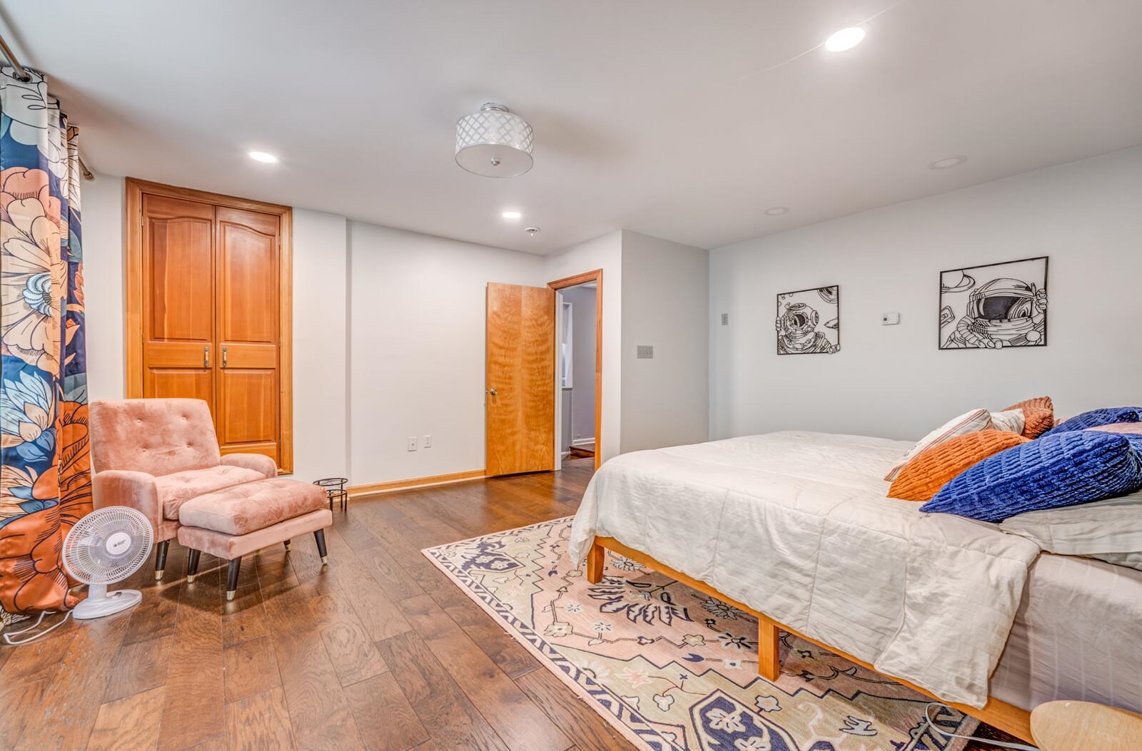 8651 Baylor Road Bartlett, TN 38002 - Photo 12 of 29 a bedroom with a bed and wooden floor