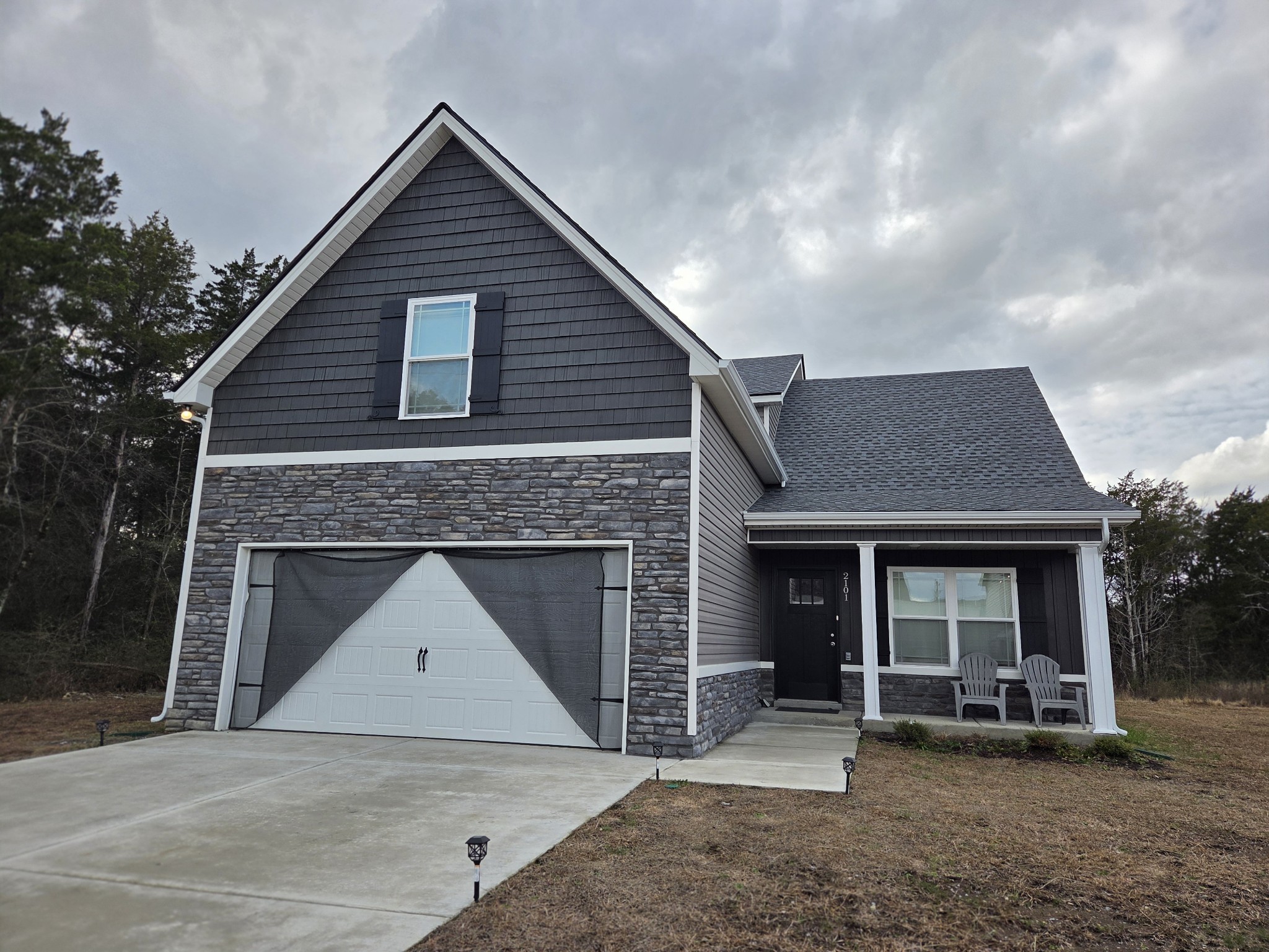 2101 Red Barn Road Christiana, TN 37037 - Photo 76 of 76 a front view of a house with a garden and porch