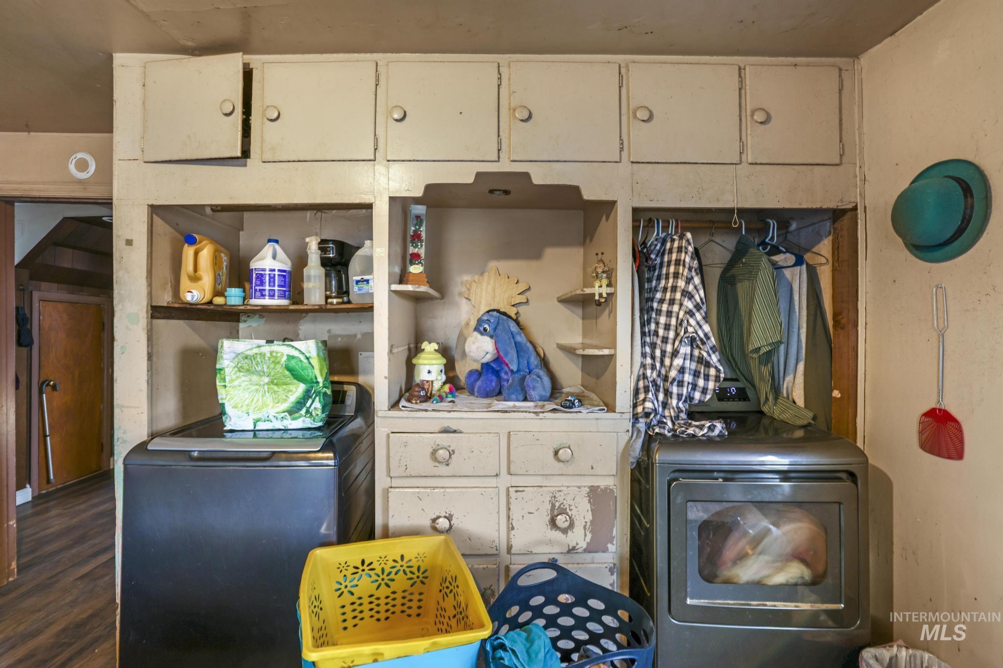 669 Locust Street South Twin Falls, ID 83301 - Photo 11 of 37 Kitchen featuring a wood stove, wood finished floors, and open shelves