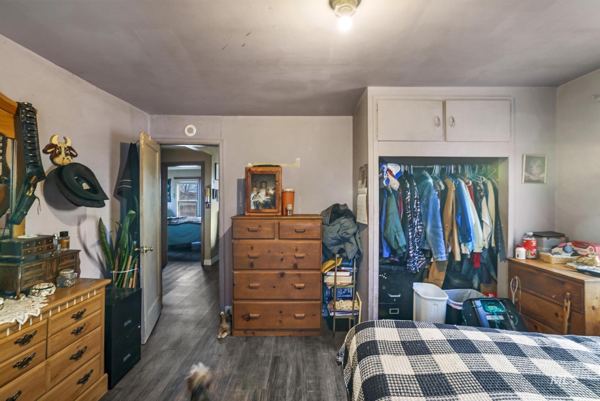 669 Locust Street South Twin Falls, ID 83301 - Photo 15 of 37 Bedroom with a closet and dark wood-style flooring