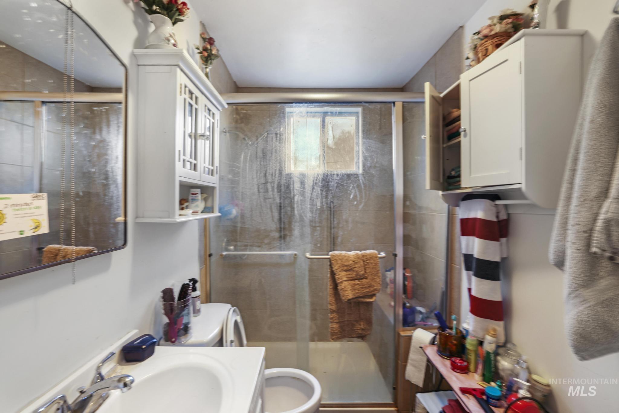 669 Locust Street South Twin Falls, ID 83301 - Photo 17 of 37 Full bath featuring a shower stall and vanity