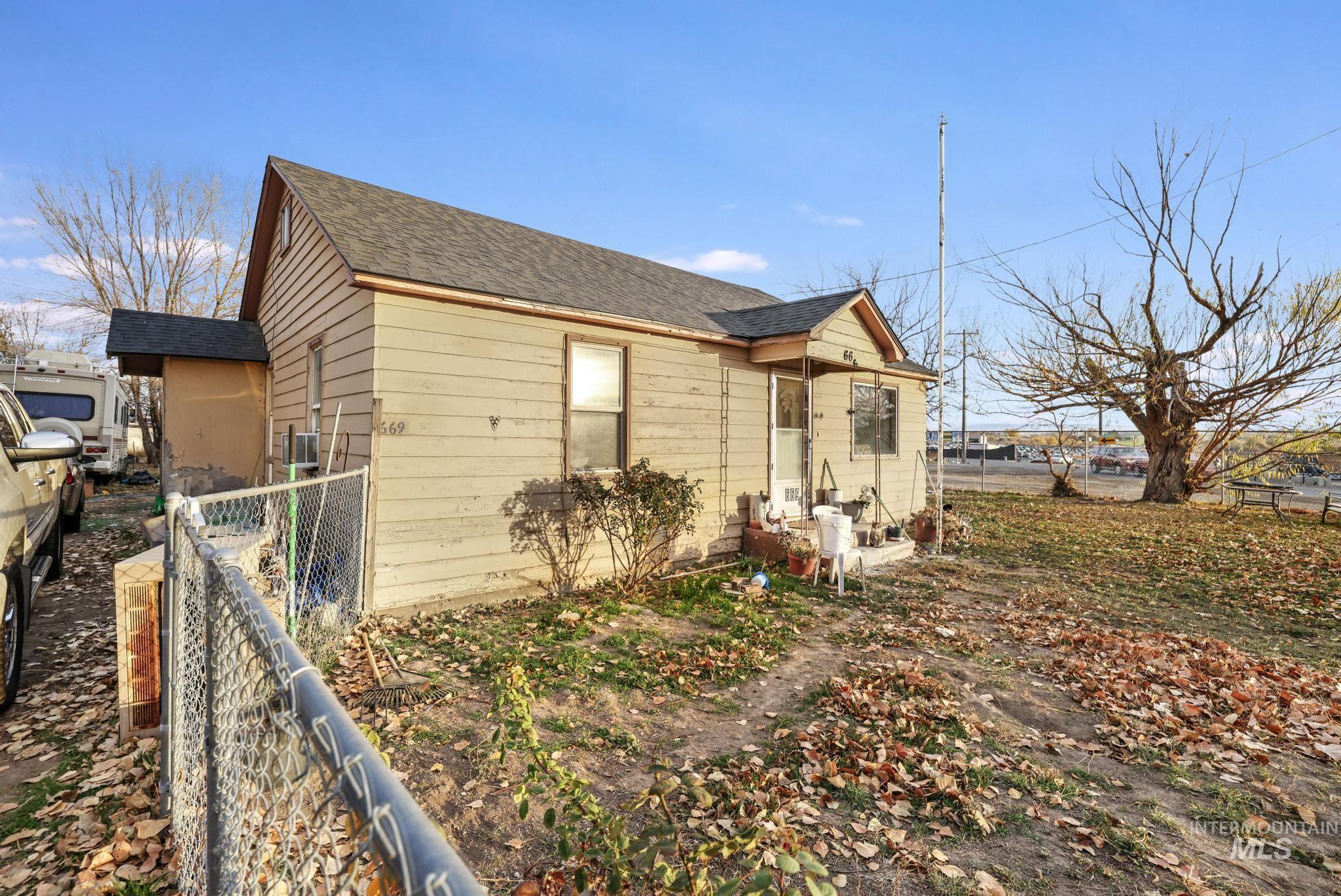 669 Locust Street South Twin Falls, ID 83301 - Photo 22 of 37 View of side of home with roof with shingles