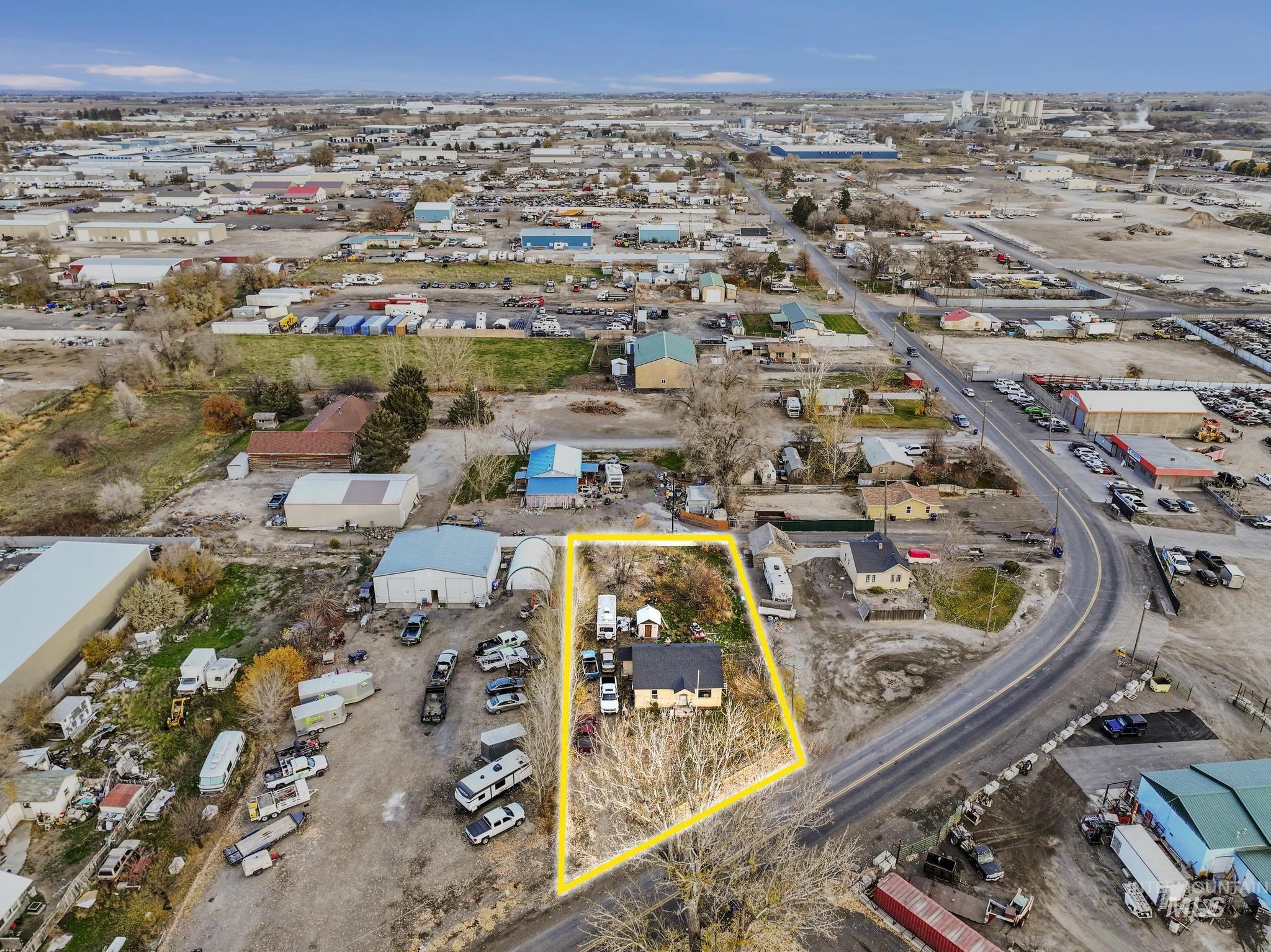 669 Locust Street South Twin Falls, ID 83301 - Photo 34 of 37 Aerial view of property's location with property boundaries highlighted and an industrial area