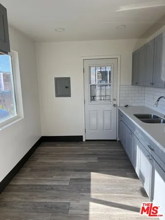 a view of a kitchen from the hallway