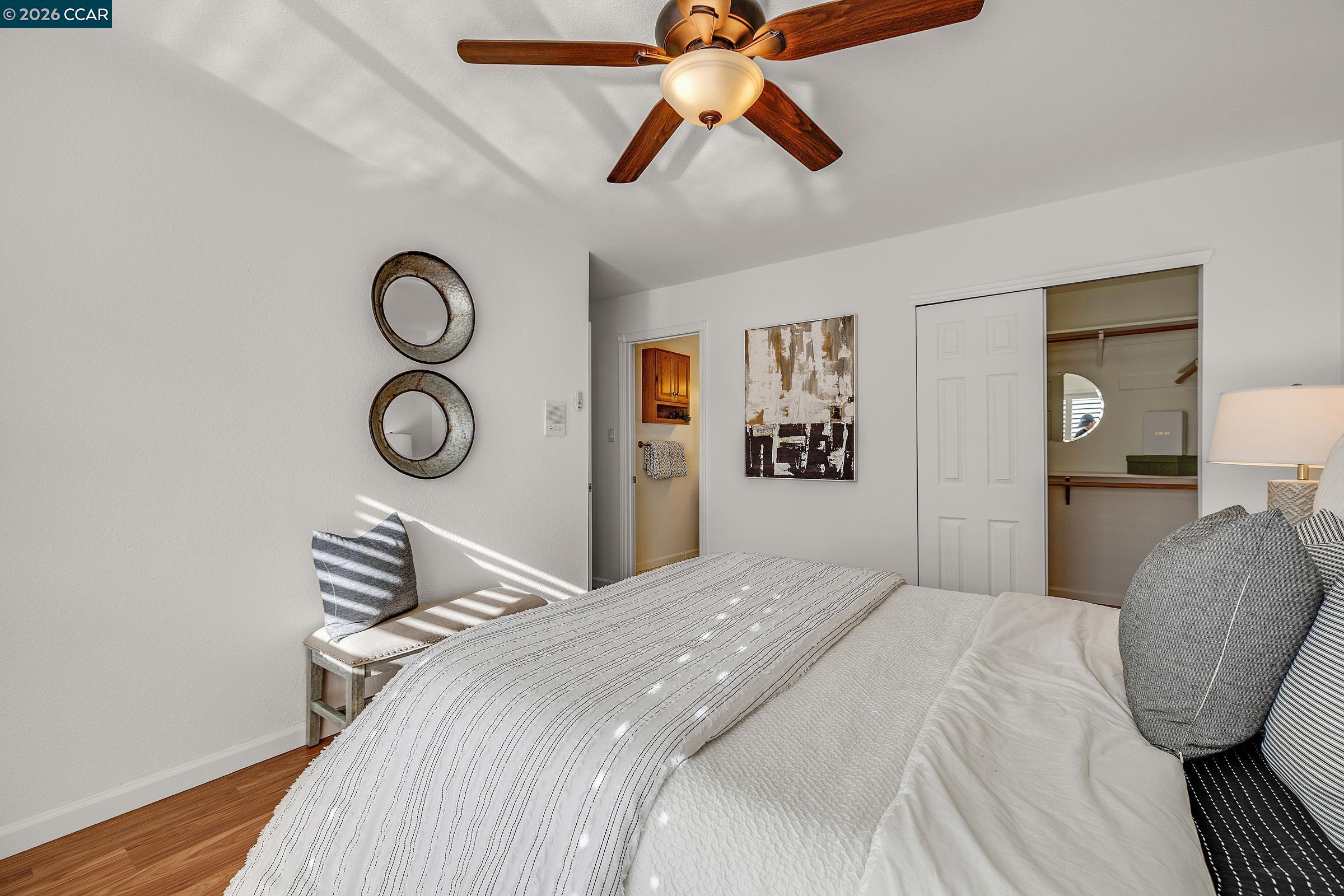 9597 Davona Drive San Ramon, CA 94583 - Photo 11 of 38 a bedroom with a bed and a chandelier