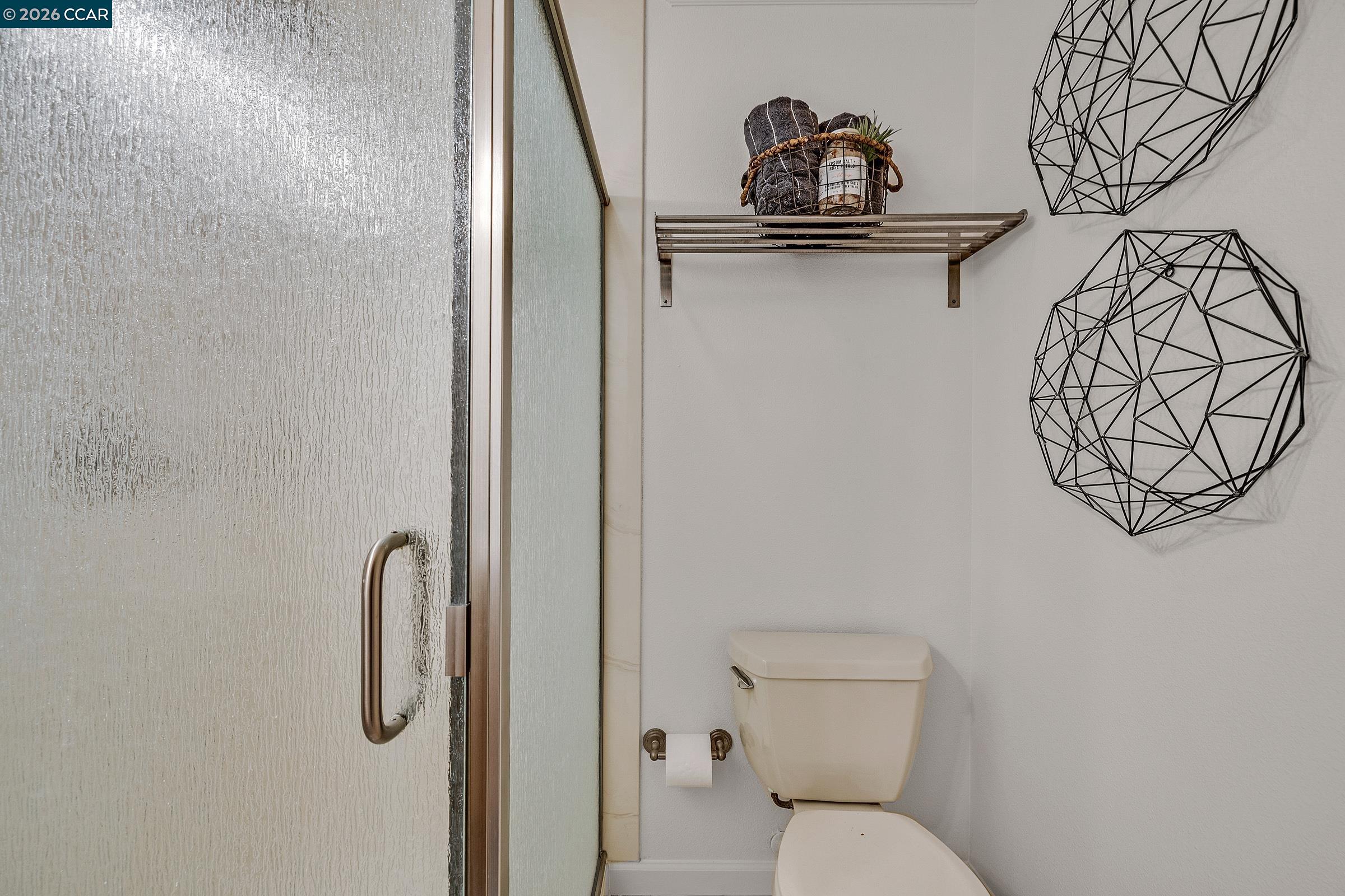 9597 Davona Drive San Ramon, CA 94583 - Photo 14 of 38 a bathroom with a toilet and a sink