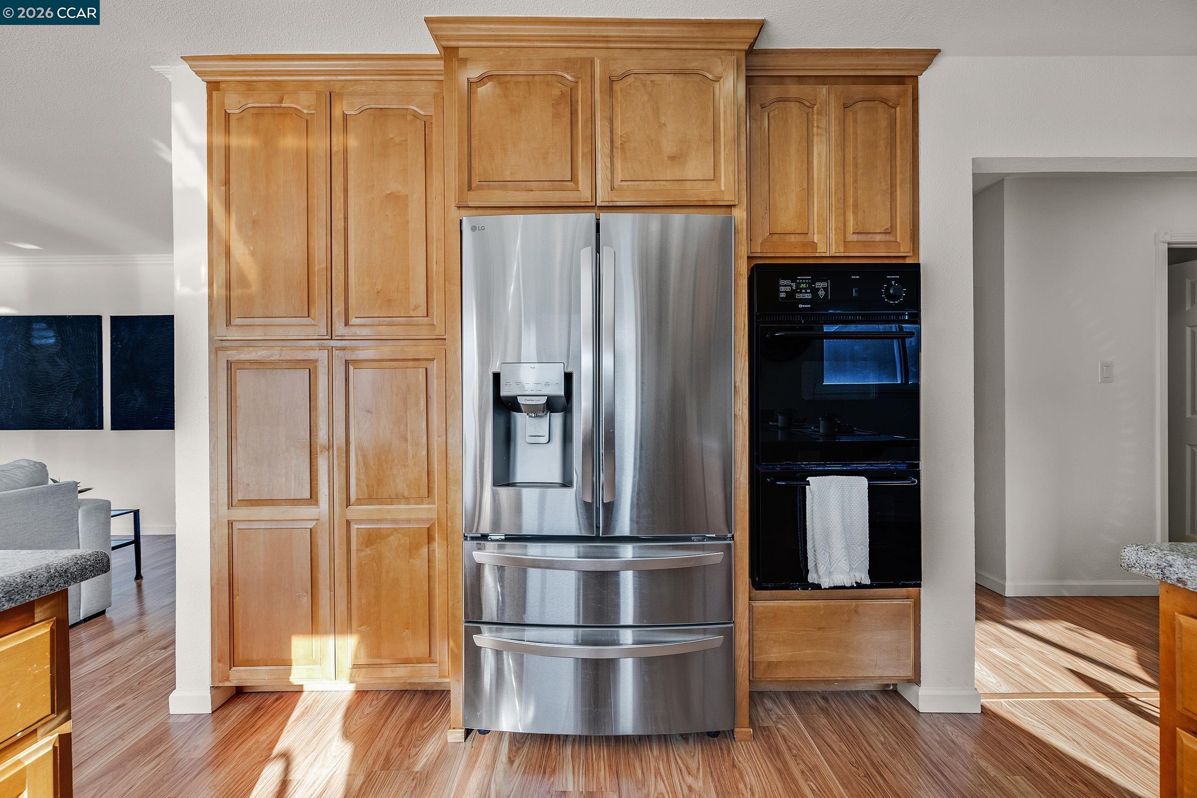 9597 Davona Drive San Ramon, CA 94583 - Photo 16 of 38 a kitchen with granite countertop stainless steel appliances a refrigerator and cabinets