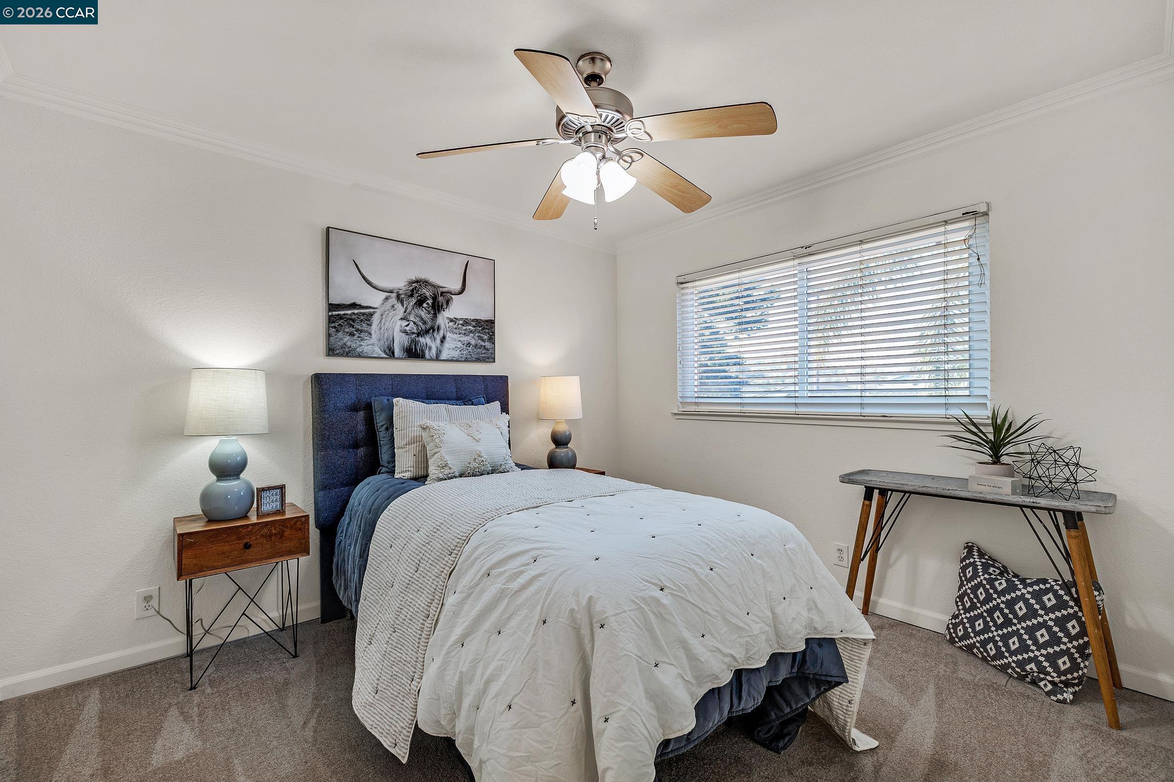 9597 Davona Drive San Ramon, CA 94583 - Photo 19 of 38 a bedroom with a bed and a chandelier