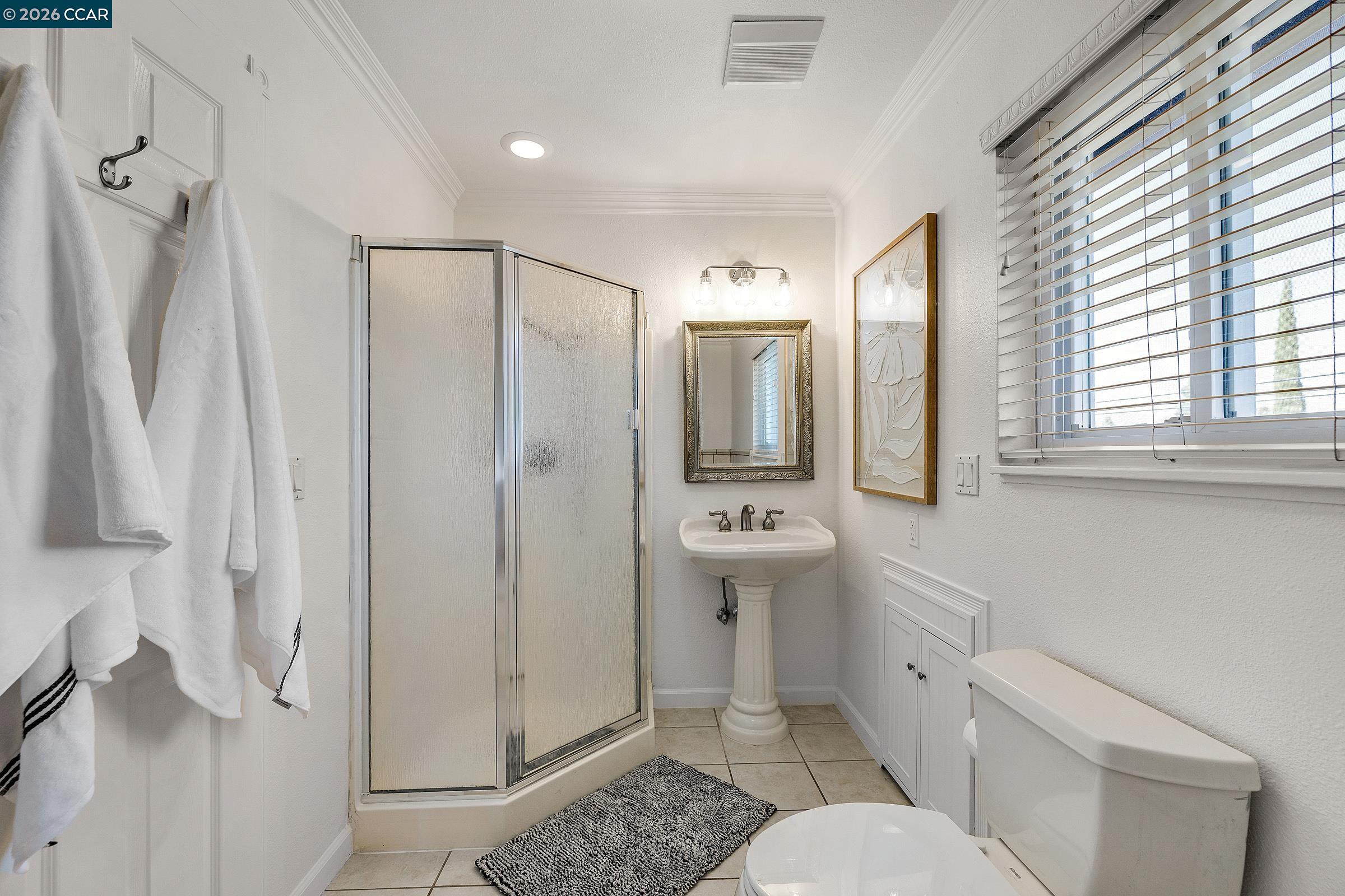 9597 Davona Drive San Ramon, CA 94583 - Photo 26 of 38 a bathroom with a sink toilet and shower