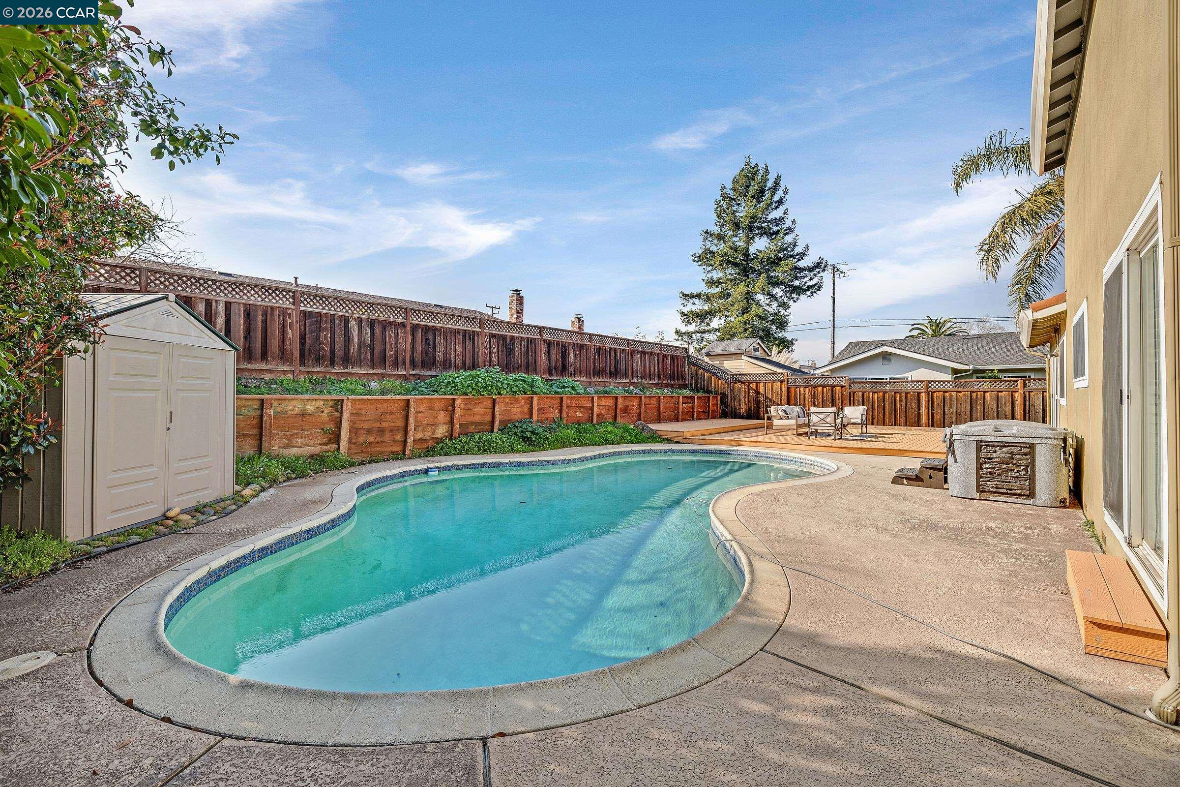 9597 Davona Drive San Ramon, CA 94583 - Photo 32 of 38 a view of a swimming pool with a yard