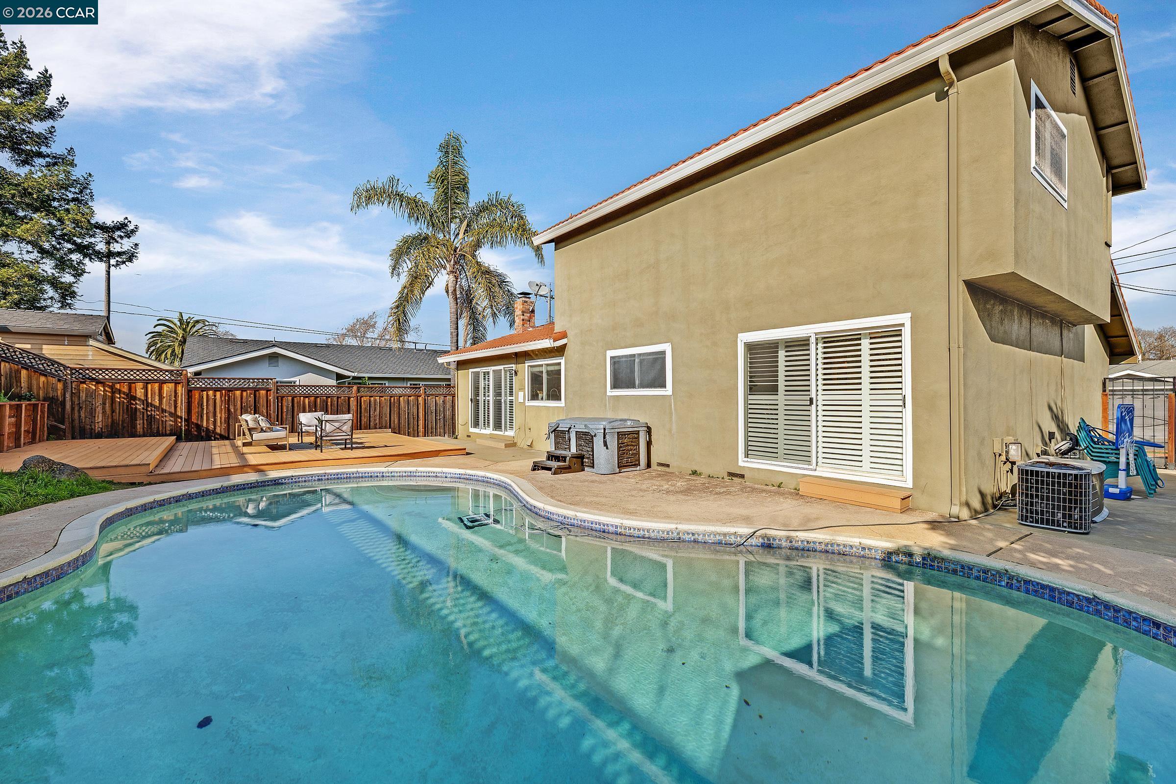 9597 Davona Drive San Ramon, CA 94583 - Photo 33 of 38 a view of a house with pool and chairs