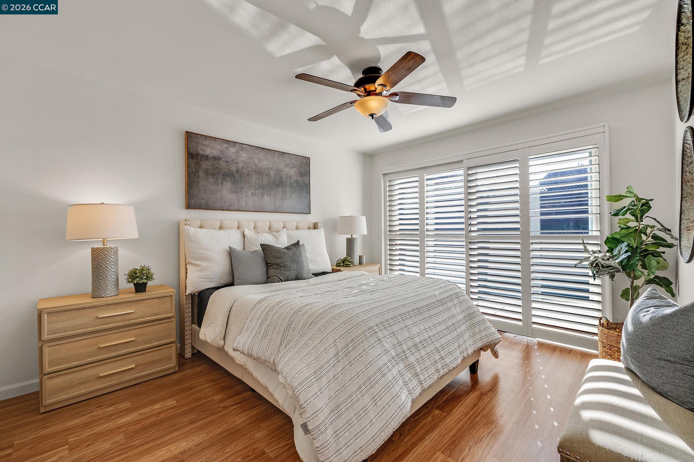 9597 Davona Drive San Ramon, CA 94583 - Photo 10 of 38 a bedroom with a bed and a window